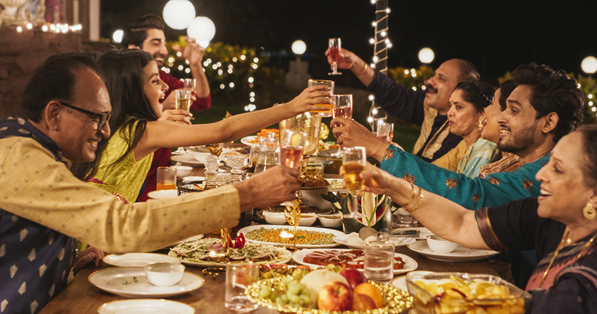 An Indian family having a traditional Diwali dinner.
