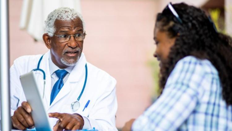 A doctor explaining to their patient the changes to Medicare Part D.