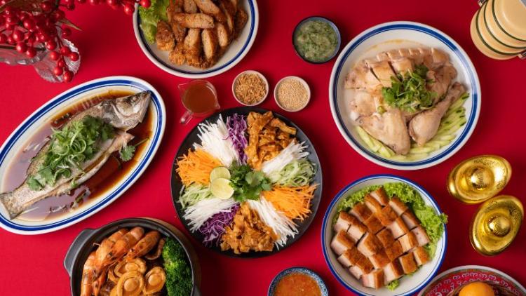 an assortment of lunar new year dishes on a table with red tablecloth